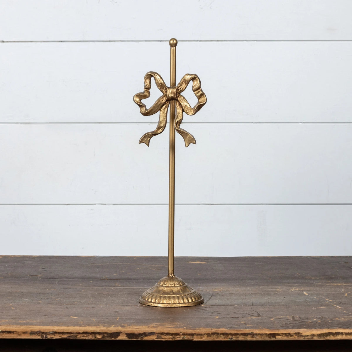 Antiqued Gold Bow Wreath Stand