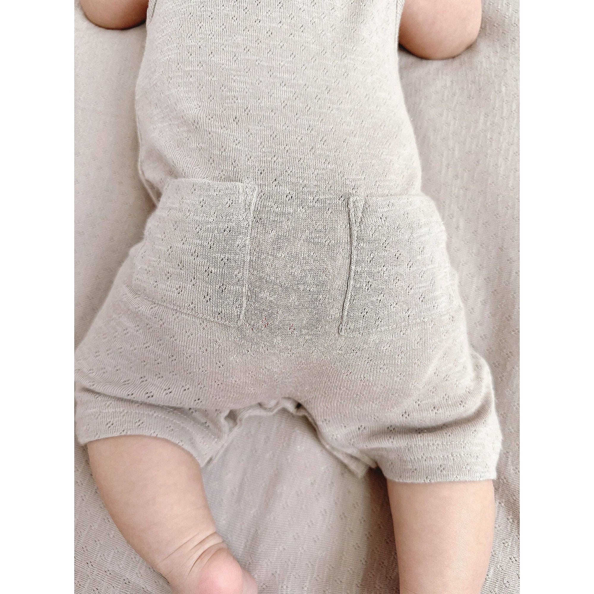 Organic Pointelle Ruffle Criss-Cross Bodysuit